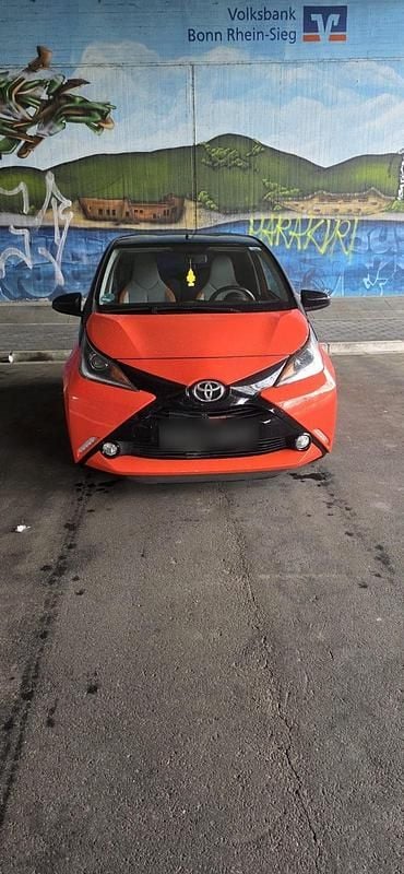 Gebraucht Toyota Aygo 69 PS (50 kW) 2014 Orange Kleinwagen