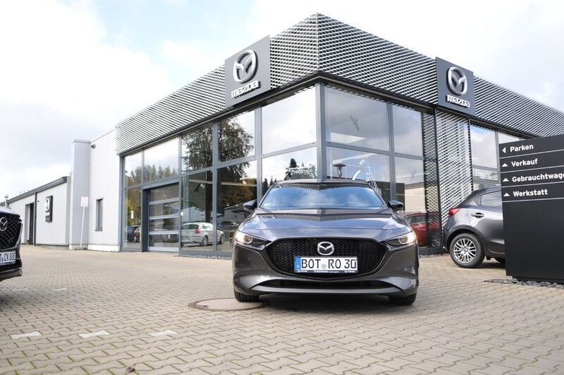 Grau Gebraucht 2024 Mazda 3 Homura-Line Limousine | 25.370 € (Superpreis) - Bild 1/4