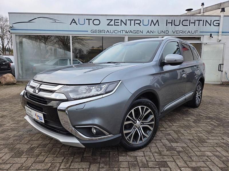 Grau Gebraucht 2016 Mitsubishi Outlander Top SUV | 16.950 € (Fairer Preis) - Bild 1/4
