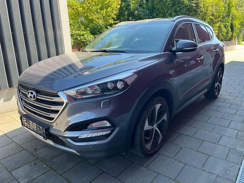 Grau Gebraucht 2015 Hyundai Tucson Premium SUV | 14.900 € (Fairer Preis) - Bild 1/4