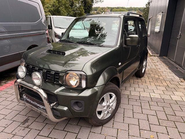 Grün Gebraucht 2015 Suzuki Jimny Comfort SUV | 15.980 € (Fairer Preis) - Bild 1/4