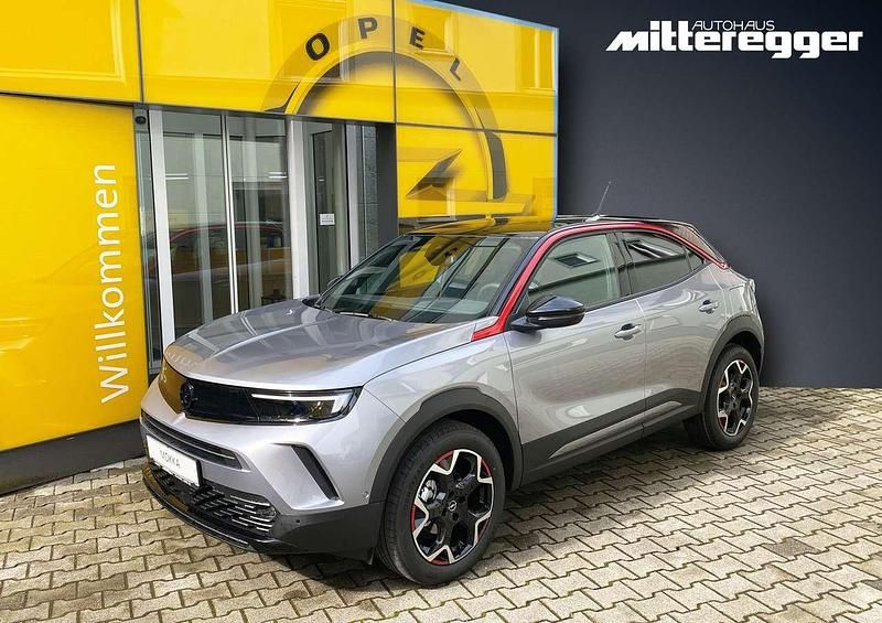 Kontrast grau (metallic) Gebraucht 2023 Opel Mokka-e SUV | 30.980 € - Bild 1/2