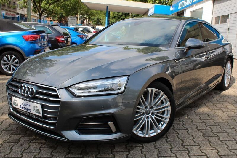 Monsungrau metallic Gebraucht 2019 Audi A5 Sportback Sport Limousine | 29.990 € (Fairer Preis) - Bild 1/4
