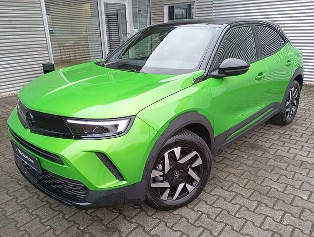 Gebraucht Opel Mokka-e GS Line 100 kW (136 PS) 2023 Lackierung matcha green/typ aussenverkleidung metalliclackierung SUV