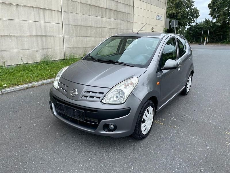 Grau Gebraucht 2012 Nissan Pixo Acenta Kleinwagen | 3.999 € (Fairer Preis) - Bild 1/4