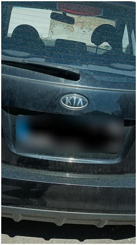 Second-hand Kia Rio 75 CP (55 kW) 2010 Negru Hatchback