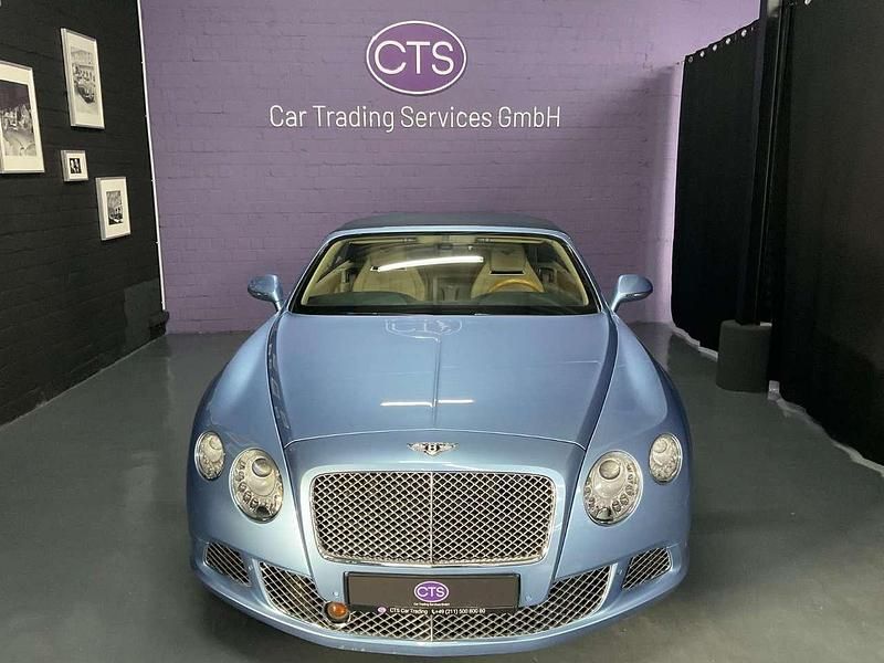 Silverlake metallic / roof blu Gebraucht 2012 Bentley Continental GT Convertible Cabrio | 71.900 € - Bild 1/4