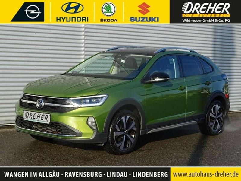 Visual green metallic Gebraucht 2022 VW Taigo Style SUV | 23.990 € (Fairer Preis) - Bild 1/4