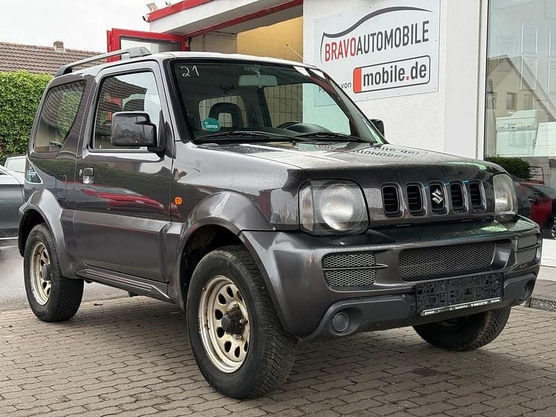 Grau Gebraucht 2012 Suzuki Jimny Ranger SUV | 10.499 € (Fairer Preis) - Bild 1/4