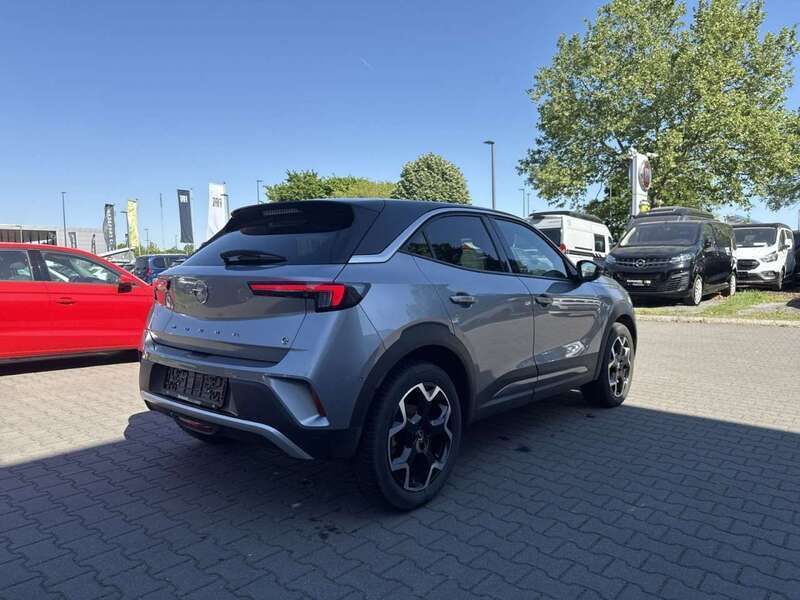 Gebraucht Opel Mokka-e Ultimate 100 kW (136 PS) 2022 Kontrast grau (silber) SUV