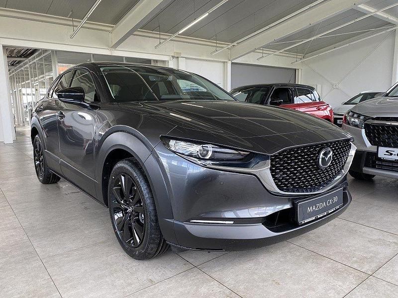 Machine gray Neu 2024 Mazda CX-30 Homura-Line SUV | 28.990 € - Bild 1/4