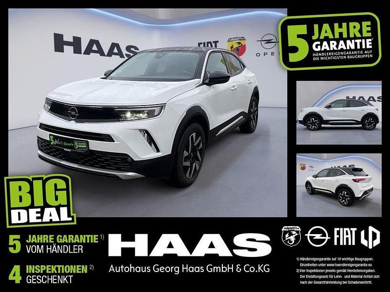 Jade weiss/arktis weiss (metallic) Gebraucht 2022 Opel Mokka-e Elegance SUV | 16.480 € (Fairer Preis) - Bild 1/4