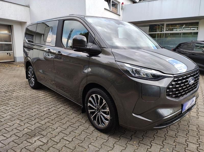 Gebraucht Ford Tourneo Titanium X 232 PS (170 kW) 2025 Magnetic grau metallic Van / Kleinbus