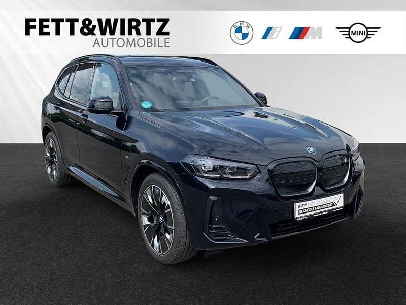 Carbonschwarz metallic Gebraucht 2024 BMW iX3 Impressive SUV | 51.490 € (Guter Preis) - Bild 1/3
