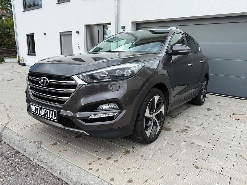 Grau Gebraucht 2015 Hyundai Tucson Premium SUV | 16.249 € (Fairer Preis) - Bild 1/4