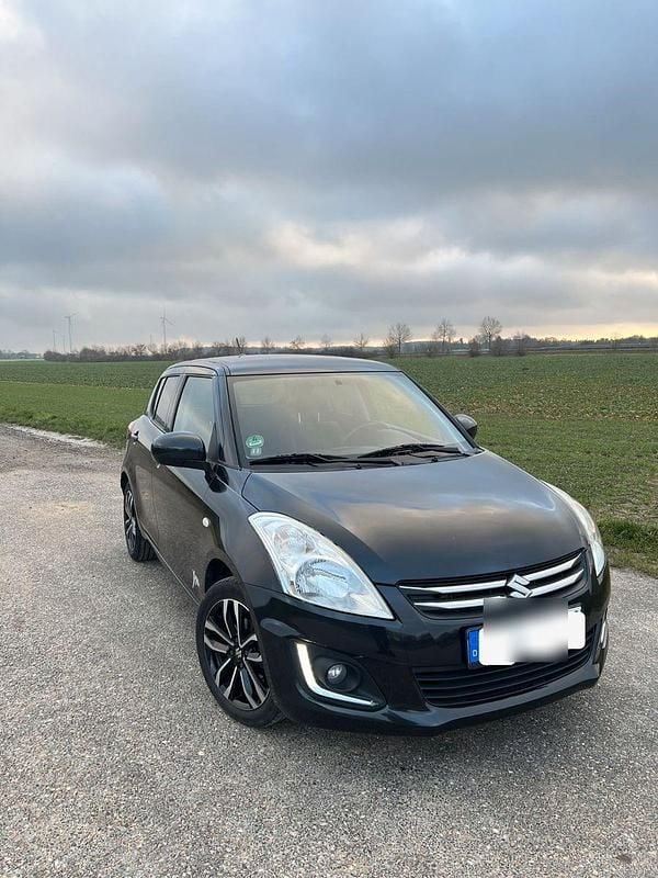 Schwarz Gebraucht 2015 Suzuki Swift X-TRA Kleinwagen | 6.600 € (Fairer Preis) - Bild 1/4