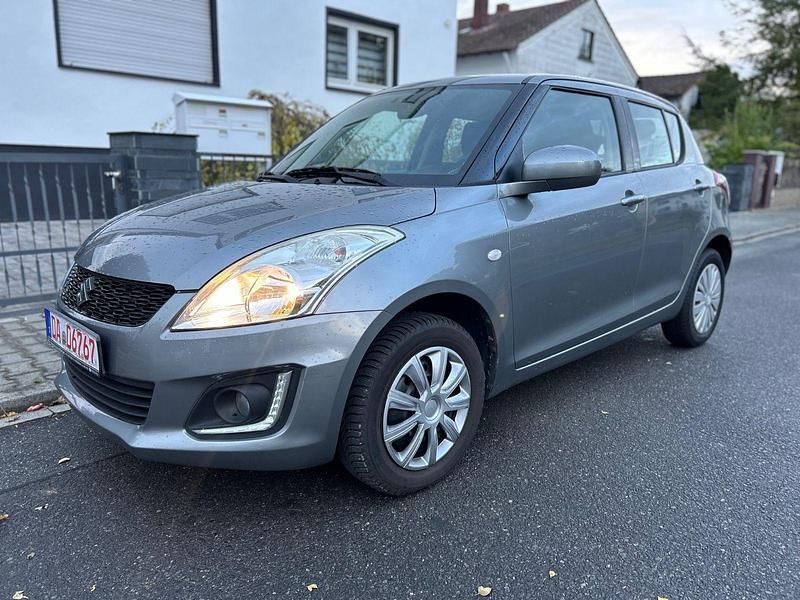 Grau Gebraucht 2015 Suzuki Swift Club Kleinwagen | 7.999 € (Fairer Preis) - Bild 1/4