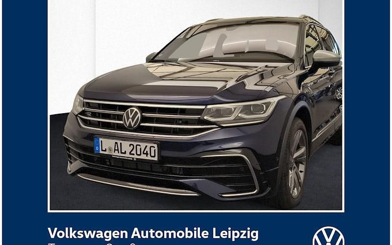 Atlantik blue metallic Gebraucht 2024 VW Tiguan Allspace R-line SUV | 45.430 € (Fairer Preis) - Bild 1/4
