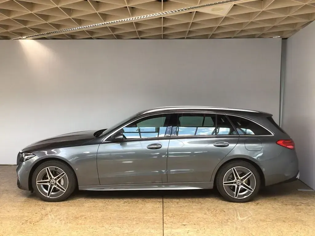 Gebraucht Mercedes C300e AMG line 313 PS (230 kW) 2025 Lack selenitgrau Kombi