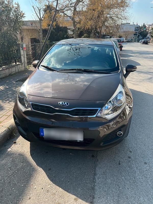 Braun Gebraucht 2015 Kia Rio Limousine | 9.200 € (Fairer Preis) - Bild 1/4