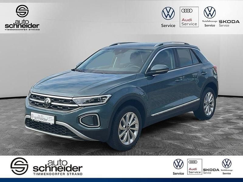 Petroleum blue metallic [bla] Gebraucht 2024 VW T-Roc Style SUV | 29.750 € (Fairer Preis) - Bild 1/4