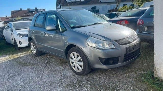 Grau Gebraucht 2007 Suzuki SX4 Limousine | 1.200 € (Superpreis) - Bild 1/4