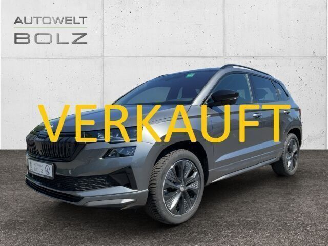 Grau Gebraucht 2024 Skoda Karoq SportLine SUV | 35.990 € (Guter Preis) - Bild 1/4