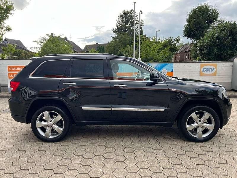 Brilliant black crystal pearl Gebraucht 2012 Jeep Grand Cherokee Overland SUV | 7.990 € (Superpreis) - Bild 1/4