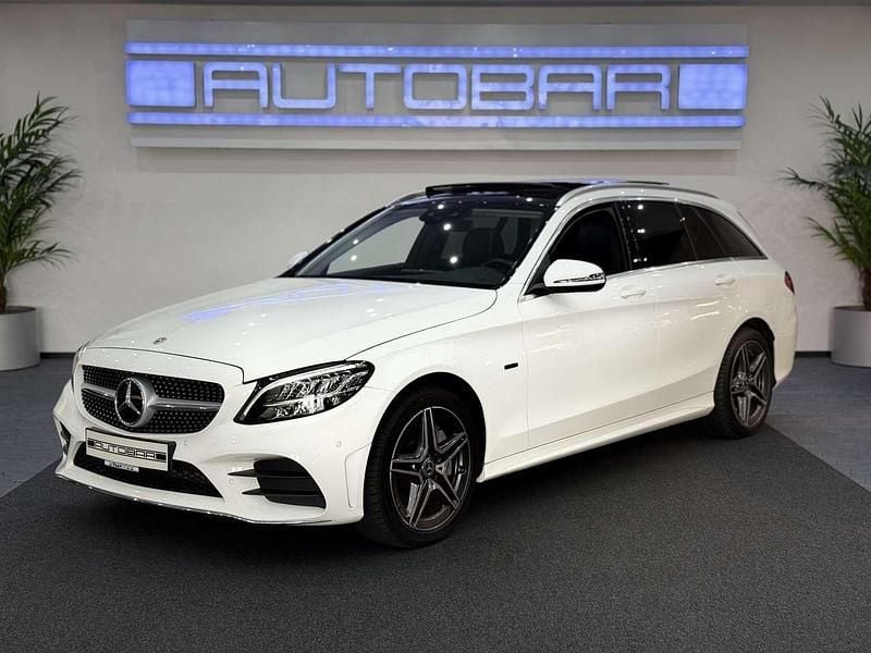 Polarweiss Gebraucht 2021 Mercedes C300e AMG line Kombi | 25.450 € (Guter Preis) - Bild 1/4