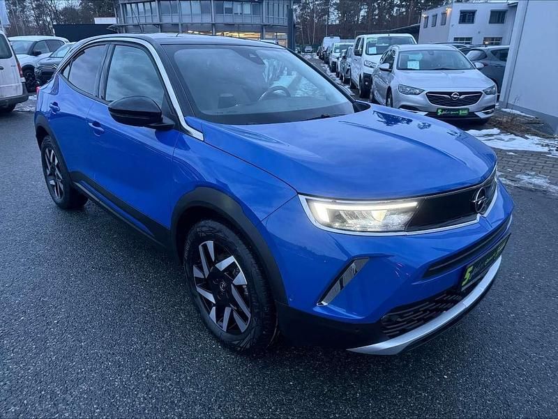 Gebraucht Opel Mokka-e Elegance 100 kW (136 PS) 2023 Lackierung voltaic blue met/ty SUV