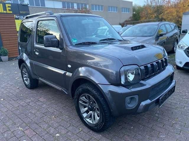 Grau Gebraucht 2015 Suzuki Jimny Style SUV | 10.999 € (Guter Preis) - Bild 1/4