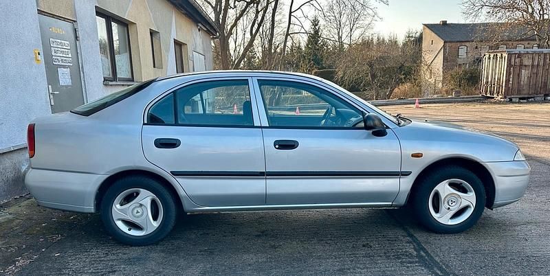 Gebraucht Mitsubishi Carisma 90 PS (66 kW) 1998 Silber Limousine
