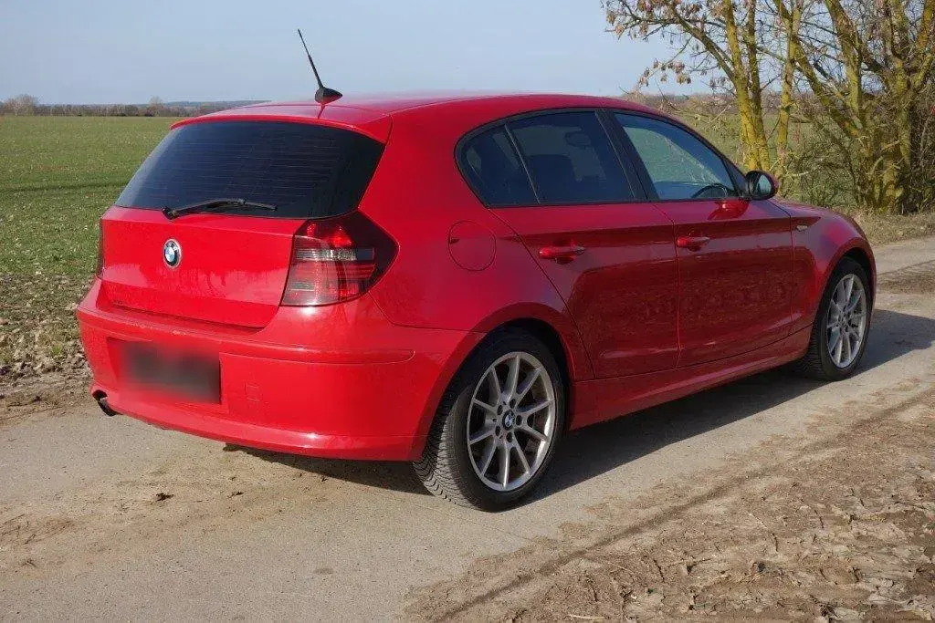Używany BMW 116 122 KM (89 kW) 2009 Czerwony Hatchback