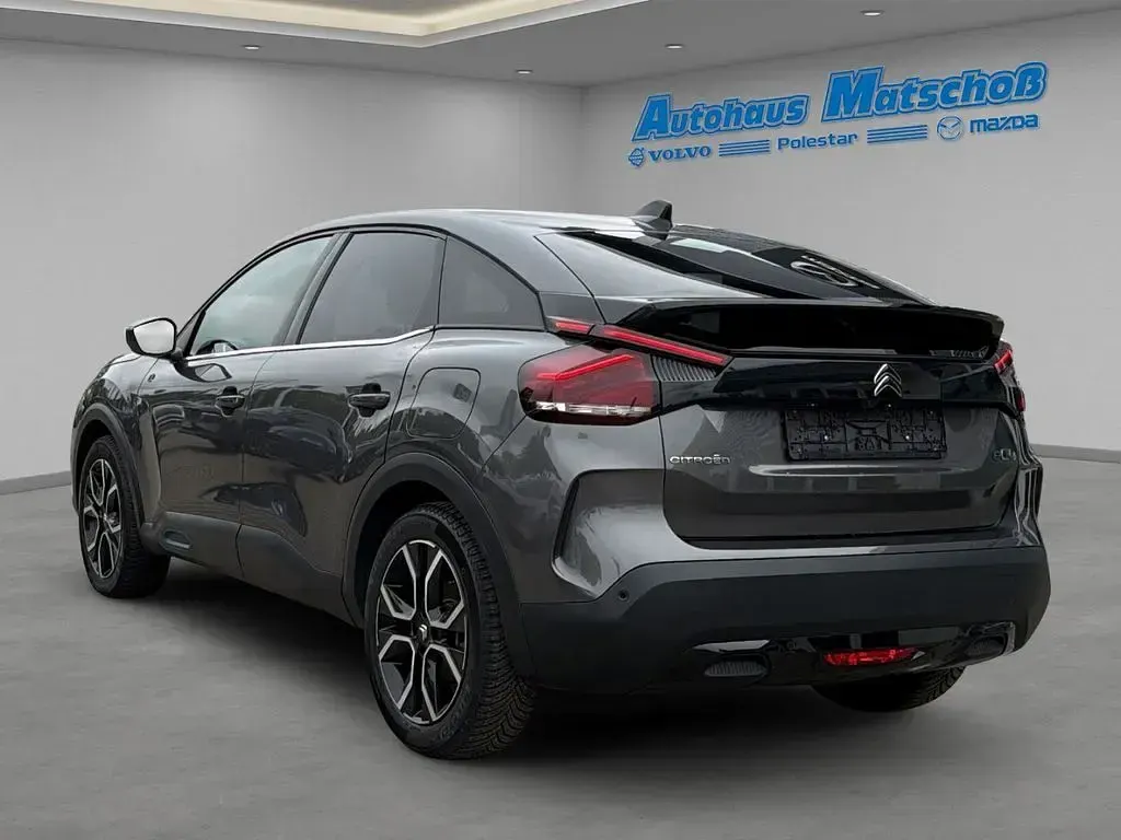 Gebraucht Citroën e-C4 Shine 100 kW (136 PS) 2023 Lackierung platiniumgrau/typ Limousine
