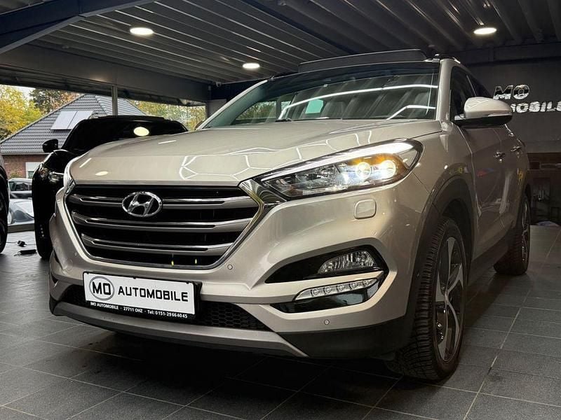 Grau Gebraucht 2016 Hyundai Tucson Premium SUV | 16.499 € (Fairer Preis) - Bild 1/4