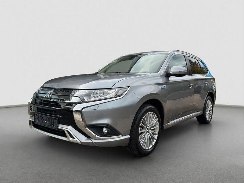 Grau Gebraucht 2019 Mitsubishi Outlander P-HEV Basis SUV | 17.900 € (Guter Preis) - Bild 1/4