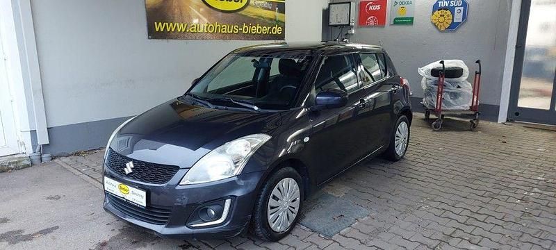 Grau Gebraucht 2015 Suzuki Swift Club Kleinwagen | 4.800 € (Superpreis) - Bild 1/4