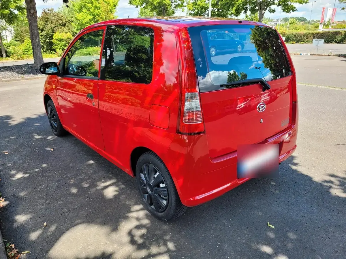 Gebraucht Daihatsu Cuore 58 PS (42 kW) 2006 Rot Kleinwagen