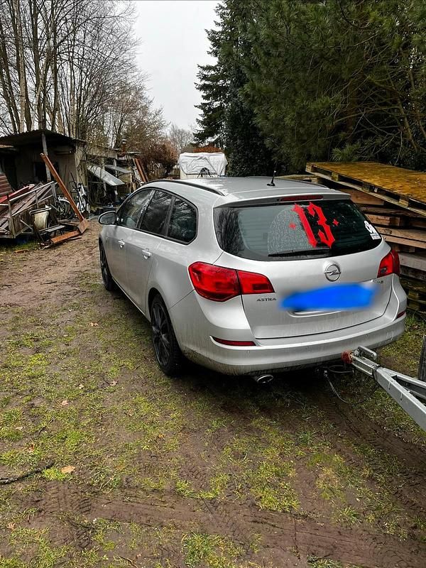 Second-hand Opel Astra 170 CP (125 kW) 2012 Argintiu Break
