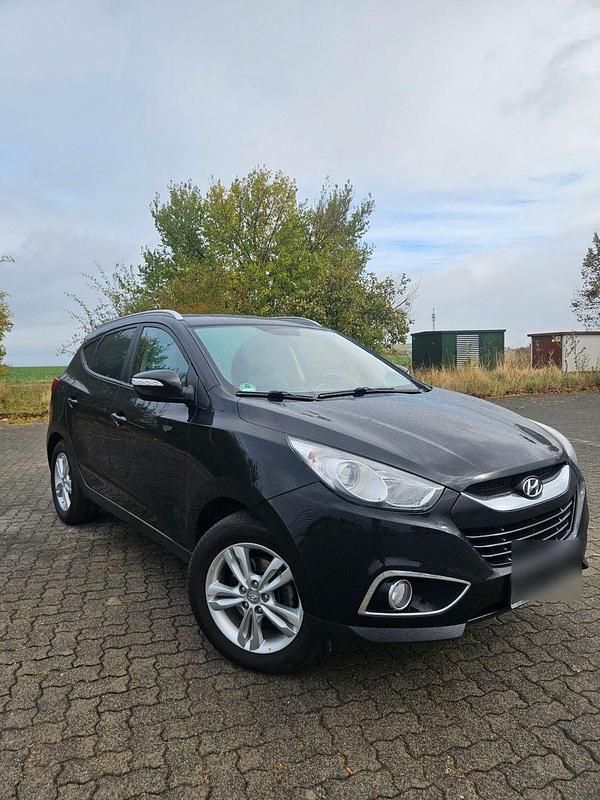 Schwarz Gebraucht 2013 Hyundai Tucson SUV | 7.699 € - Bild 1/4