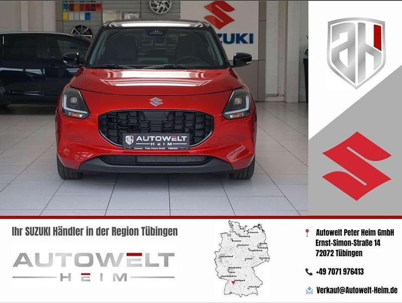 Burning red pearl metallic / s Neu 2025 Suzuki Swift Comfort+ Kleinwagen | 21.480 € - Bild 1/4