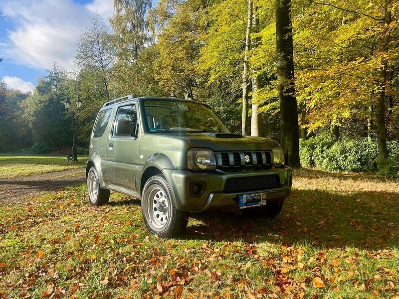 Grün Gebraucht 2016 Suzuki Jimny Comfort SUV | 13.749 € (Fairer Preis) - Bild 1/4