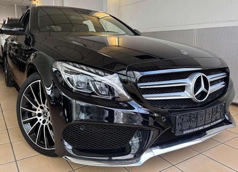 Obsidianschwarz Gebraucht 2018 Mercedes C250 AMG line Kombi | 22.900 € (Fairer Preis) - Bild 1/4