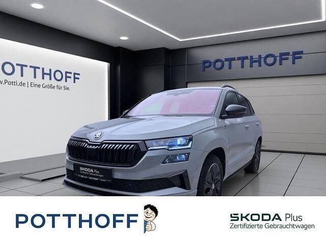 Grau Gebraucht 2024 Skoda Karoq SportLine SUV | 36.277 € (Guter Preis) - Bild 1/4