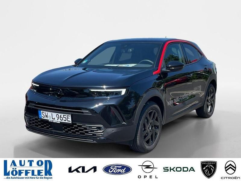 Karbon schwarz Gebraucht 2024 Opel Mokka-e SUV | 26.880 € (Teuer) - Bild 1/4