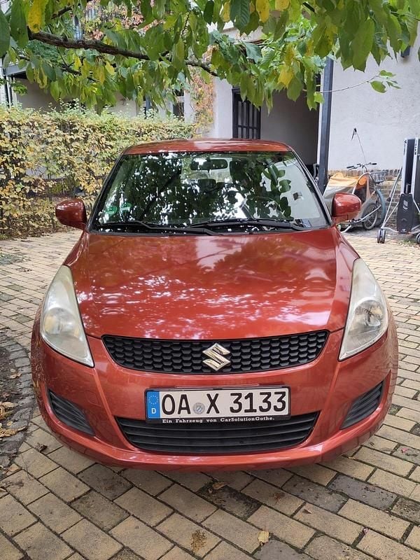 Orange Gebraucht 2011 Suzuki Swift Kleinwagen | 5.900 € (Fairer Preis) - Bild 1/4
