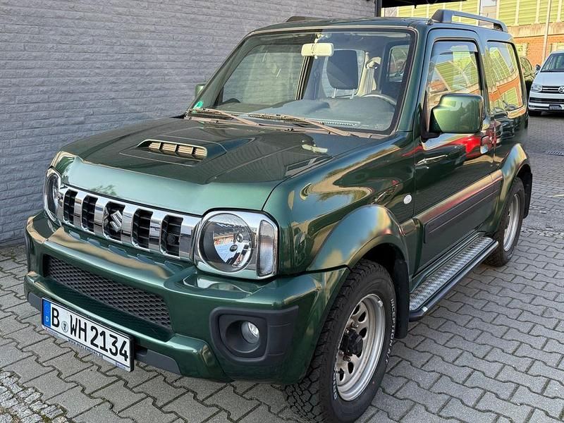 Grün Gebraucht 2012 Suzuki Jimny Style SUV | 15.900 € (Fairer Preis) - Bild 1/4