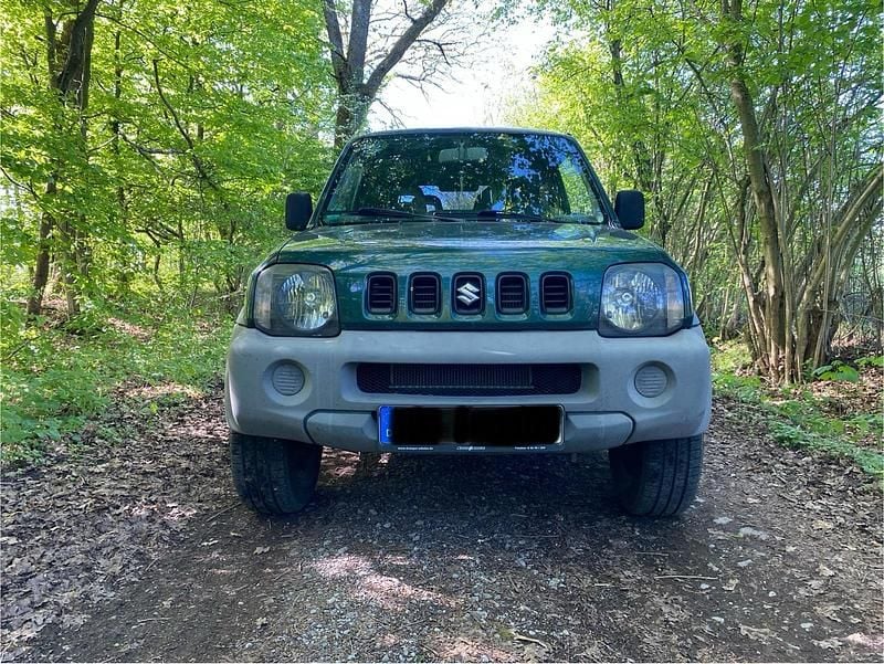 Grün Gebraucht 2006 Suzuki Jimny SUV | 5.700 € (Fairer Preis) - Bild 1/4