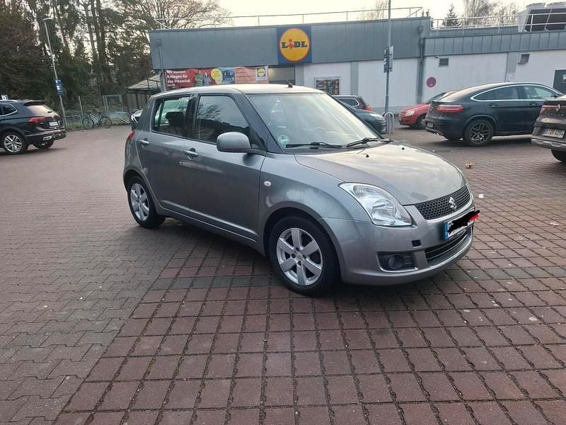 Grau Gebraucht 2010 Suzuki Swift Kleinwagen | 4.999 € (Fairer Preis) - Bild 1/4