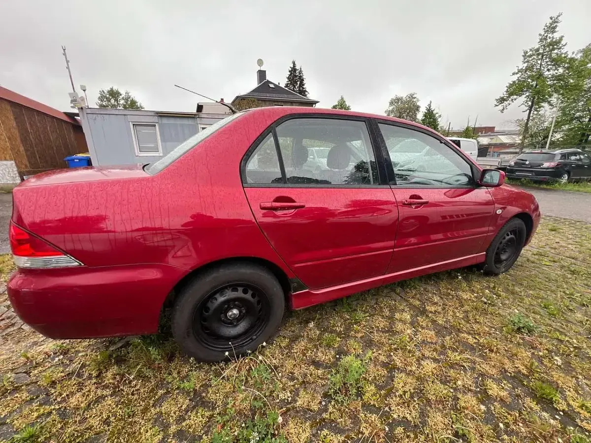 Second-hand Mitsubishi Lancer Comfort Edition 98 CP (72 kW) 2004 Roșu Berlinǎ